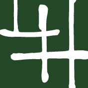 Laraine Herring monogram logo. Dark green square with intersecting L and H.
